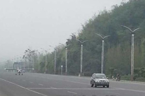 Plane landing on near-empty road in Beichuan, Sichuan