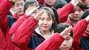 Chinese students salute during a flag-raising ceremony at a junior high school in Shanghai. Photo from NPR